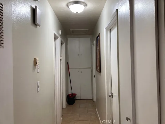 Looking down the hall Bathroom and main bedroom on left, 2 other bedrooms on the right