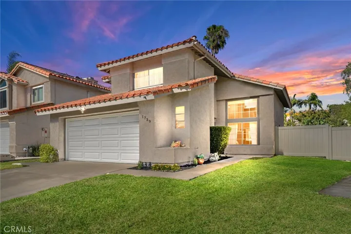 Image has been edited to alter the exterior lighting of the property and the sky.