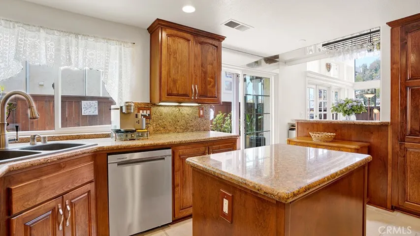 Your kitchen overlooks your backyard which can be accessed by the sliding glass door in the kitchen.