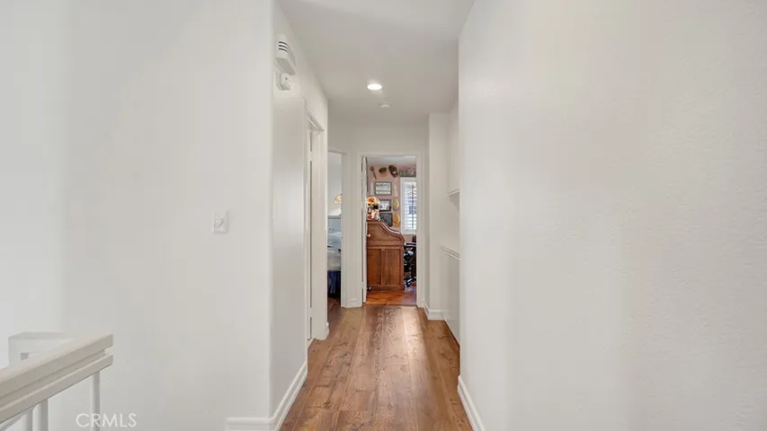 Upstairs hallway that connects all of the bedrooms and there is an additional storage space as well in the hallway.