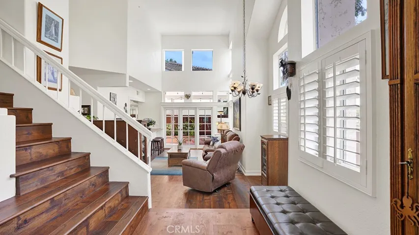 Another view of the living room taken from the perspective of the main entrance to your home.