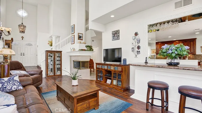 Another view of the living room area, showing the custom wet bar area that was added.