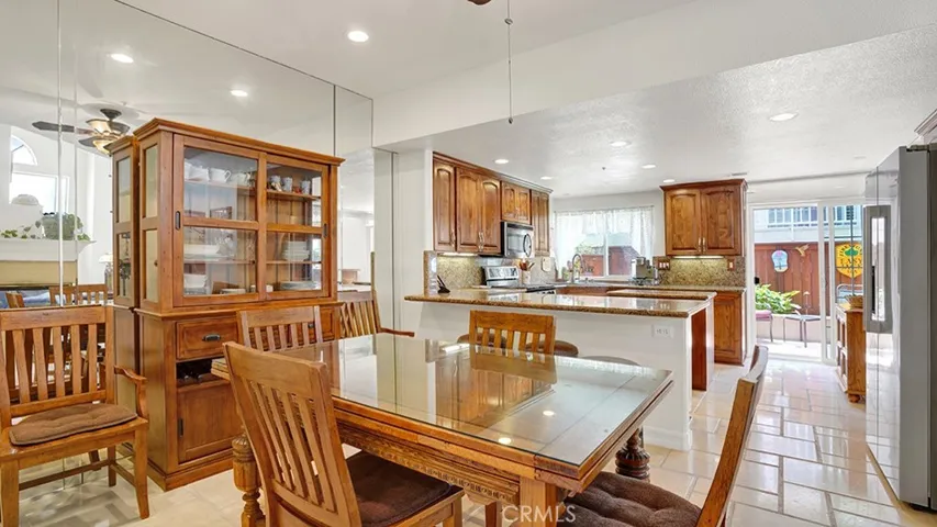 There is plenty of space to sit and entertain between the dining room and the kitchen bar top area.