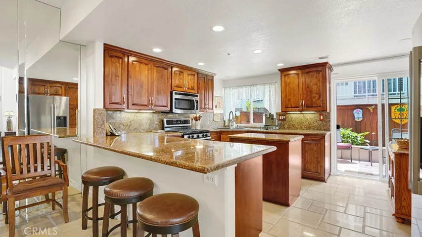 Granite countertops, travertine flooring, stainless steel appliances, recessed lights and more are found throughout your kitchen.