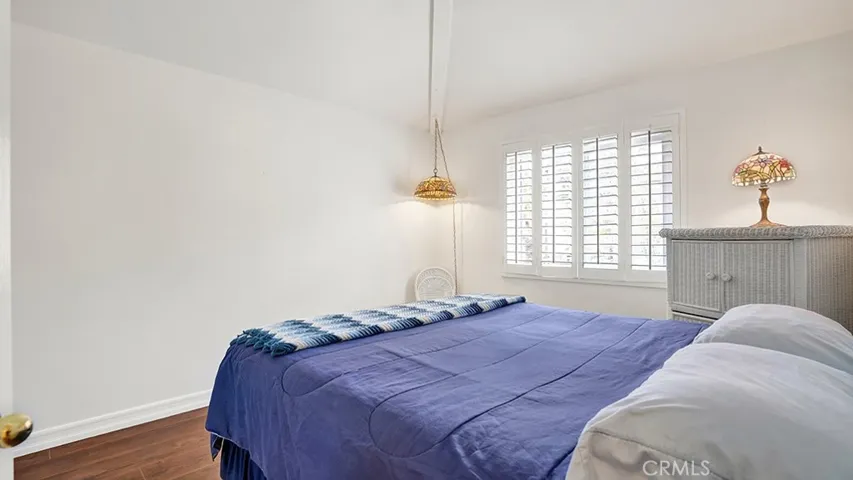 This is the left guest bedroom that has sliding mirrored closet doors.