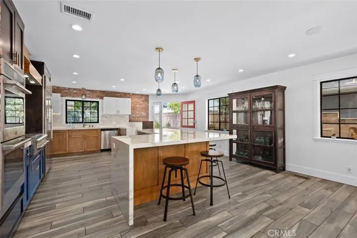 Beautifully remodeled kitche and did you notice the 'dutch door' to the backyard?