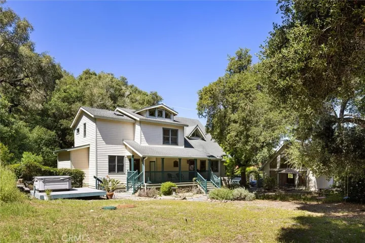Large front yard with flat grass space