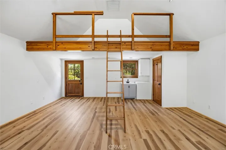 Art studio with new flooring, fresh paint, sink and half bath and loft