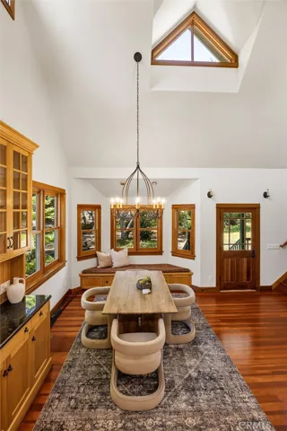 Gorgeous soaring ceiling with custom shaped windows