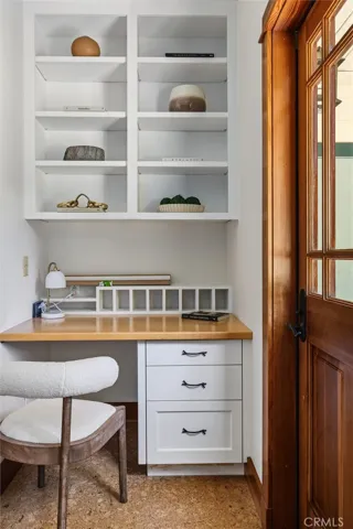 built in desk and shelving , along with separate entrance to bedrm