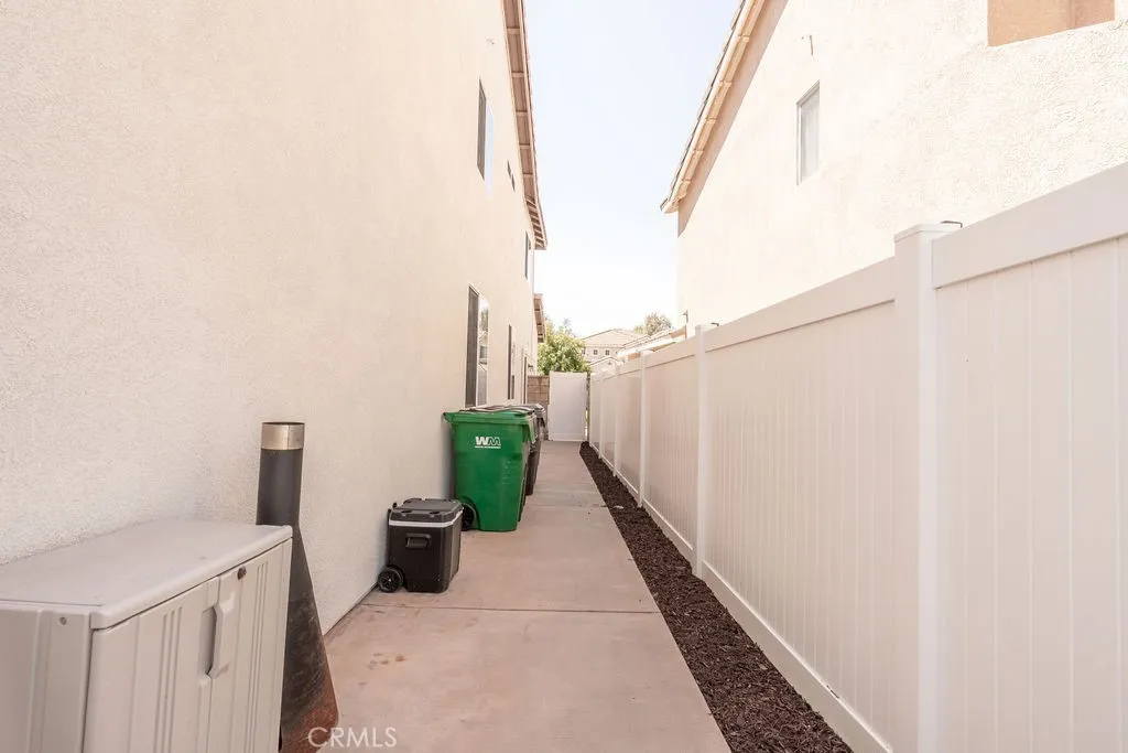 OTHER SIDE YARD WITH NEW VINYL FENCE