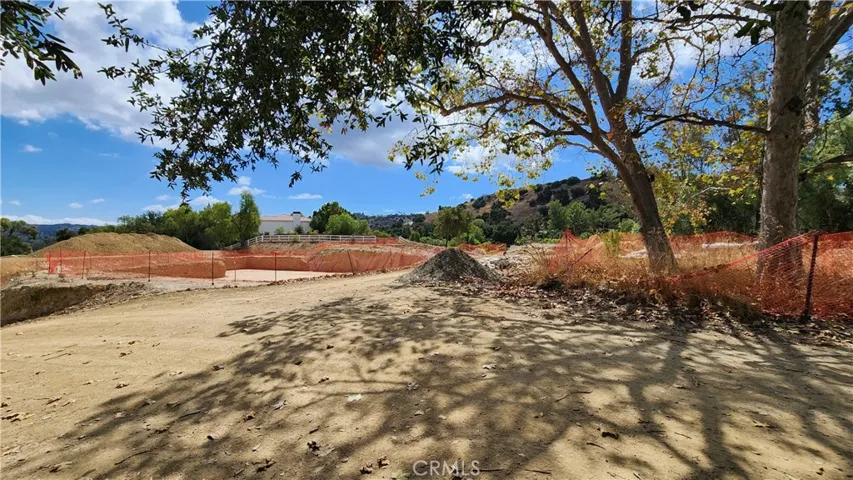 Driveway entrance to the lot is on the right side of photo.