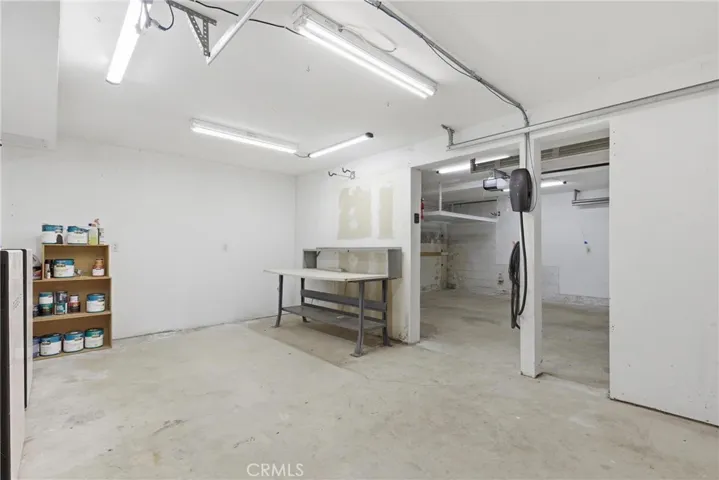 Workspace area in garage with Tesla charger