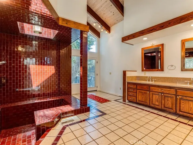 Primary Bathroom has a walk-in tile shower