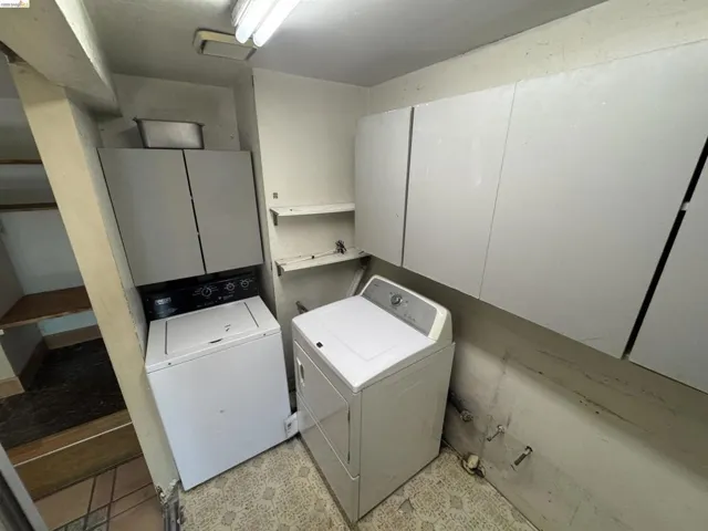 Washroom featuring washing machine and dryer and cabinet​​‌​​​​‌​​‌‌​​‌​​​‌‌​​​‌​​‌‌​​‌‌​​‌‌​​​​ space