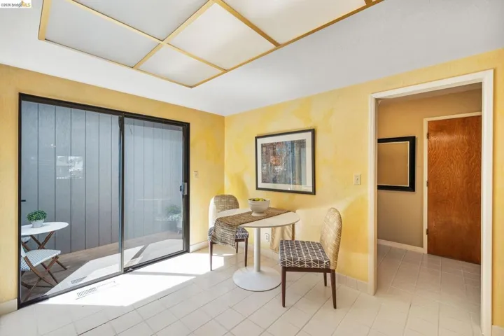 Interior space featuring tile flooring and a sliding glass door leading to an outdoor patio