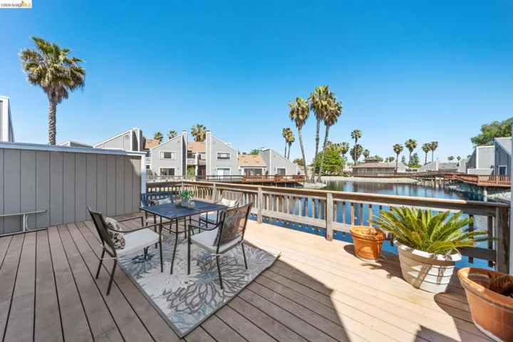 Expansive outdoor deck featuring wood flooring and a perimeter railing