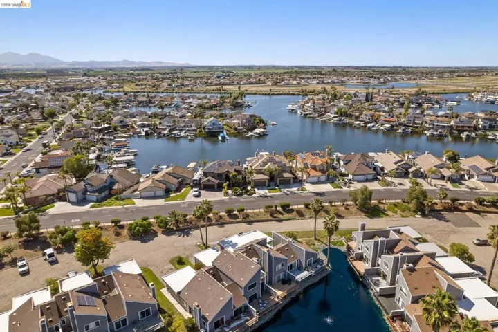 Waterfront community featuring single-family residences and townhomes with private boat docks