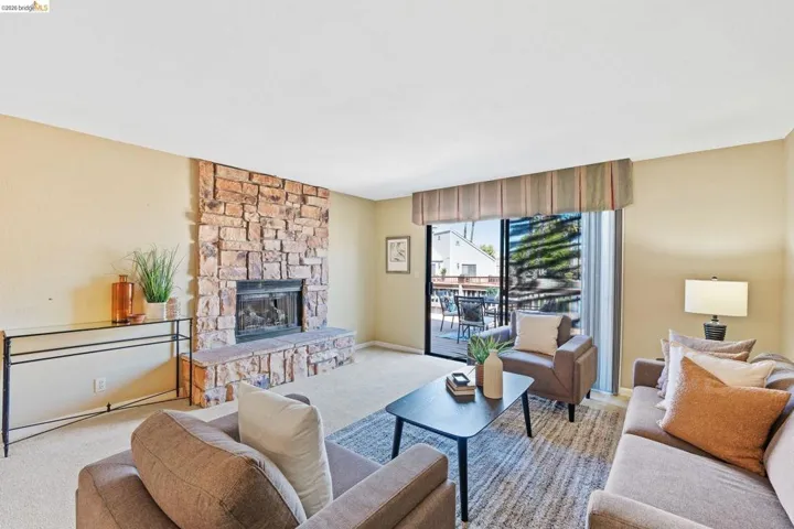 Stone-faced fireplace with a hearth extending into the room