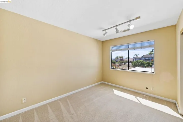 Neutral tone walls and light-toned carpeting