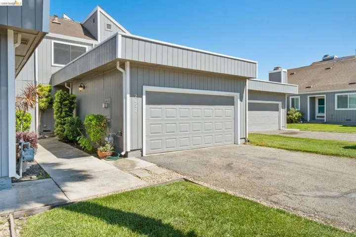 Gray exterior with vertical siding and white trim