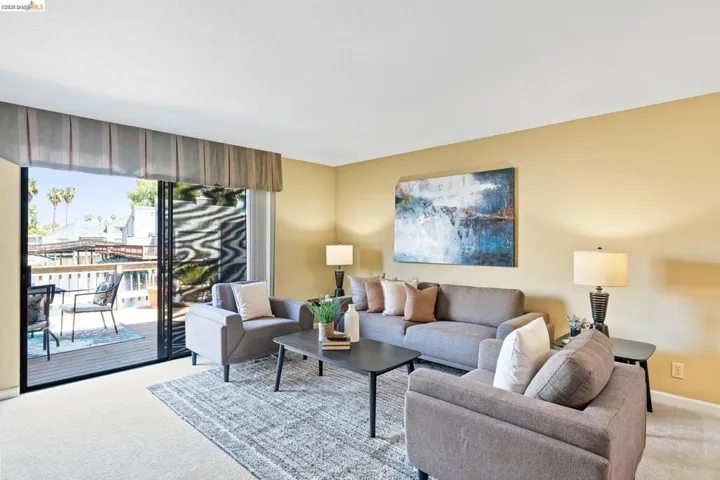 Living area with sliding glass door access to an outdoor deck
