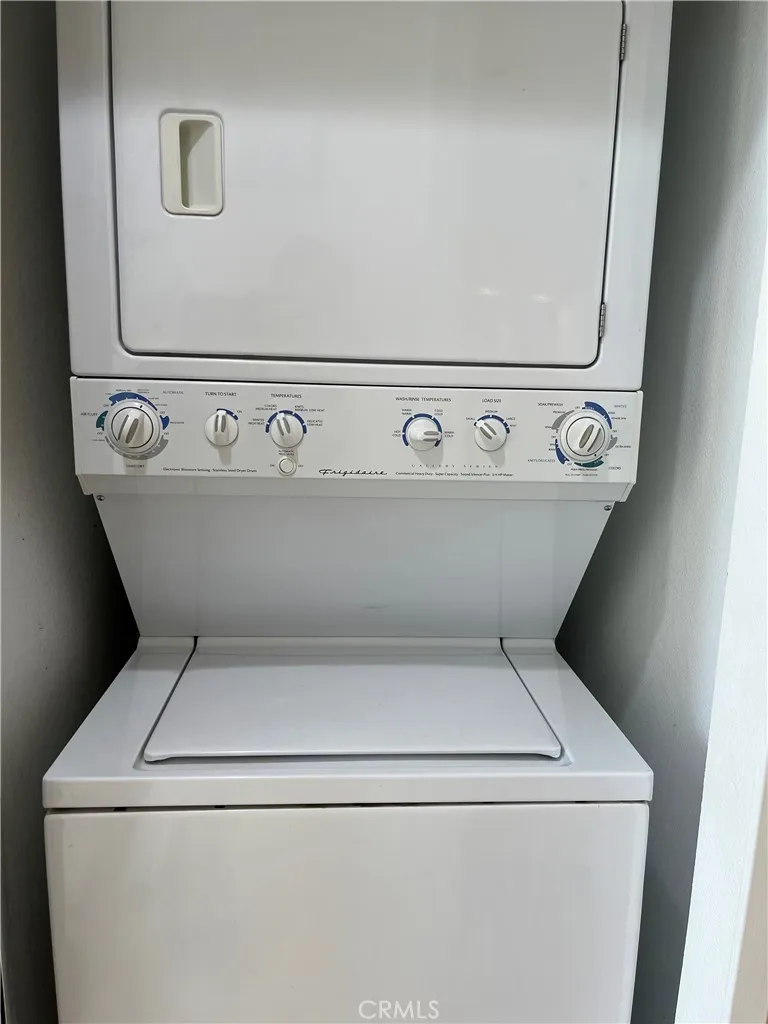 Stacked washer and dryer in unit