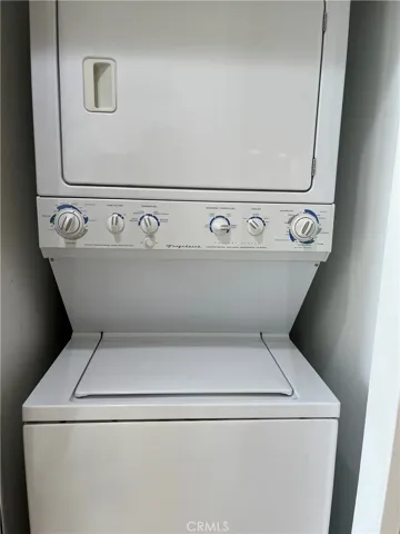 Stacked washer and dryer in unit