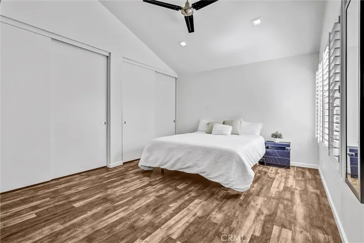 Primary room while staged. Room is now vacant. Two large closets.