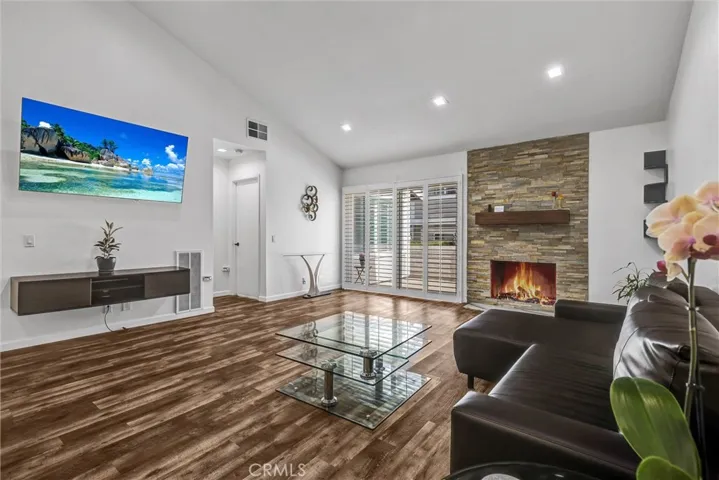 Living area, staged. Fireplace and TV are virtually enhanced.