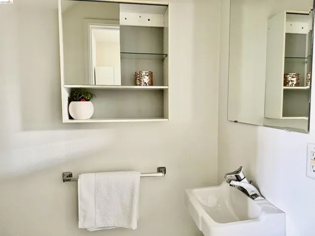 White wall-mounted sink with chrome faucet