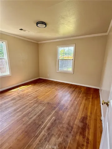 Bedroom 2 with hardwood flooring