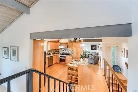 Stairs down from foyer to kitchen
