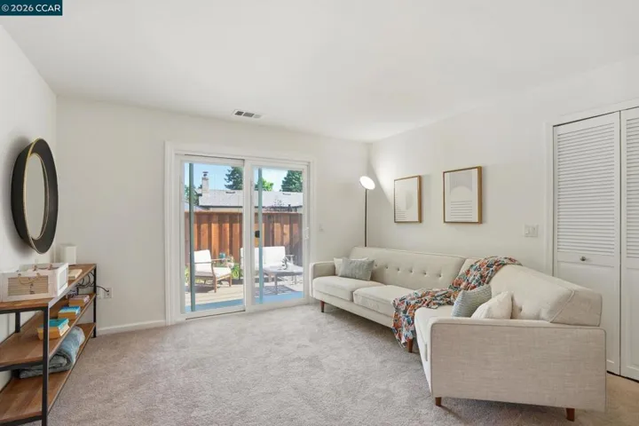 ADU livingroom and slider leading to private backyard.