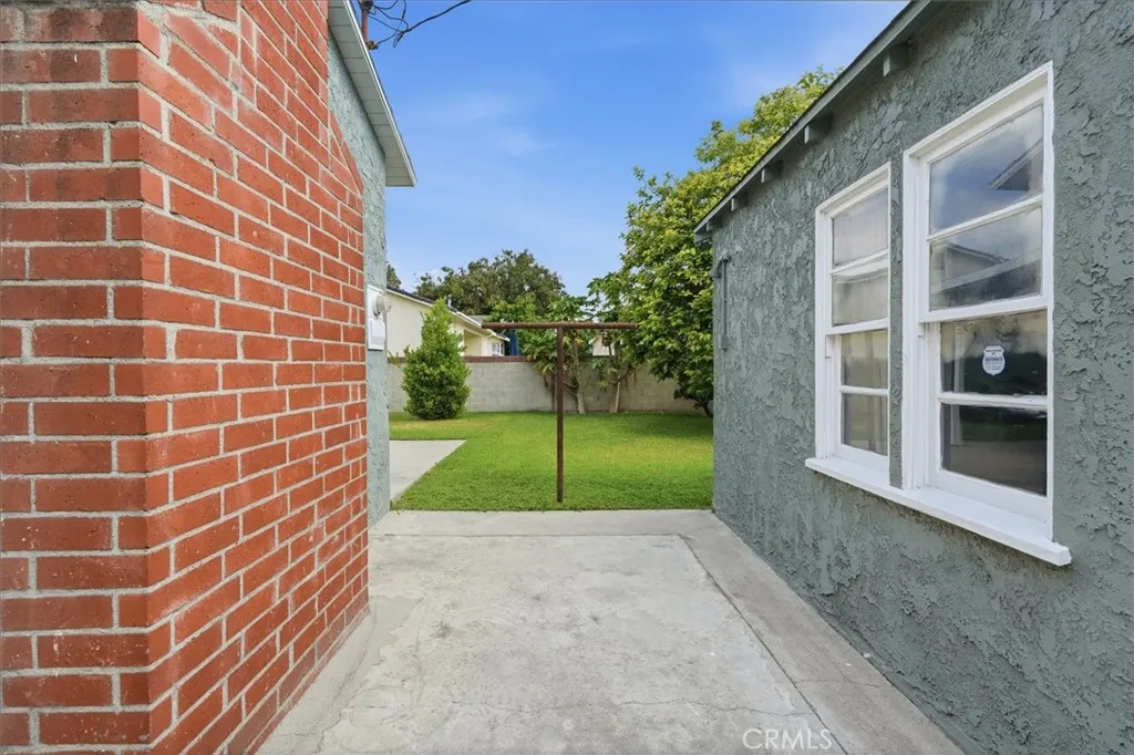 Back yard between house and detached garage