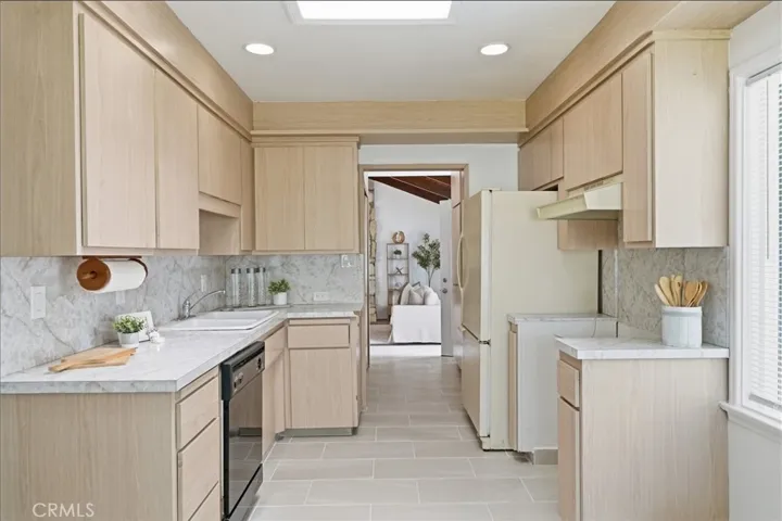 Shot of kitchen and hallway to family room