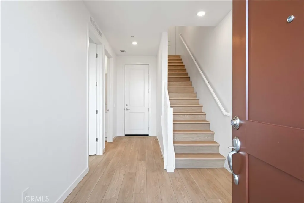 Entry from Courtyard LVP Flooring throughout