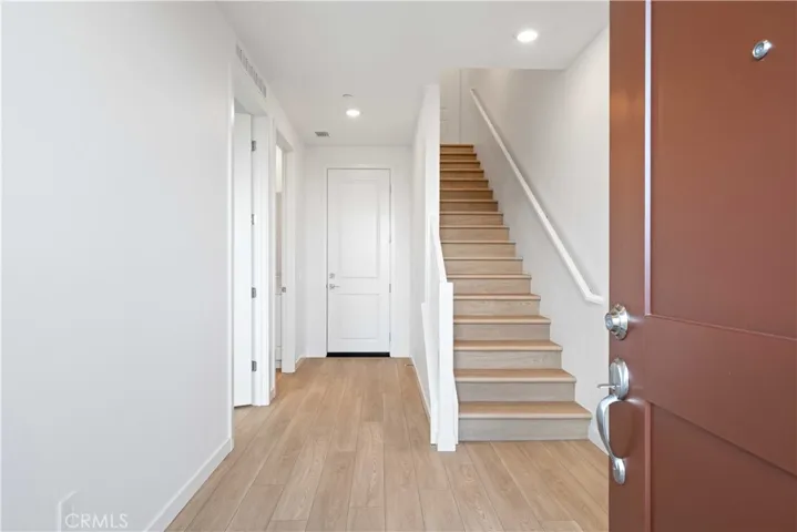 Entry from Courtyard LVP Flooring throughout