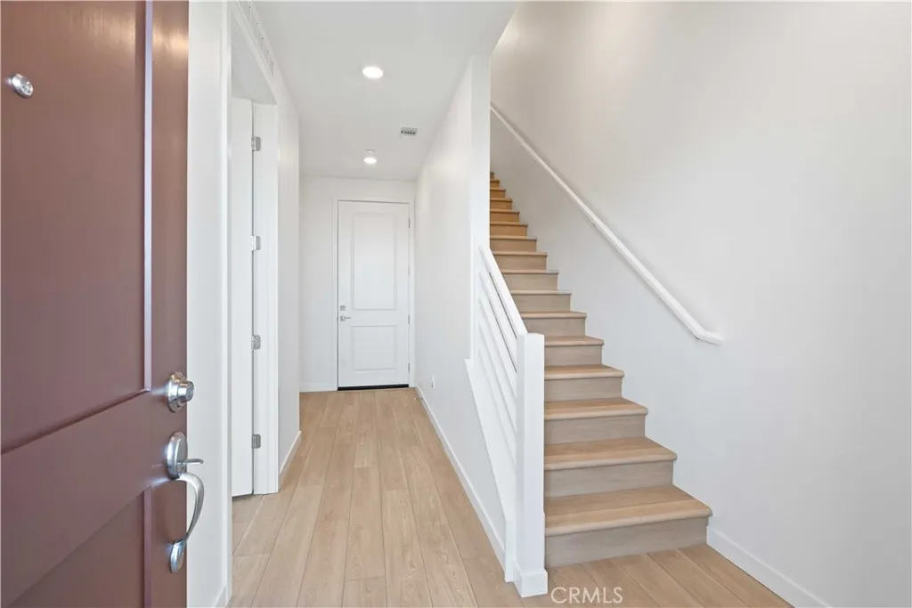 Entry from Courtyard LVP Flooring throughout