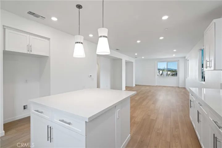 Center Island w/Pendant lighting overlooking living area