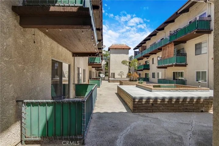 View of the private condo balcony, ideal for outdoor relaxation. The space offers a comfortable extension of the first-floor living area.