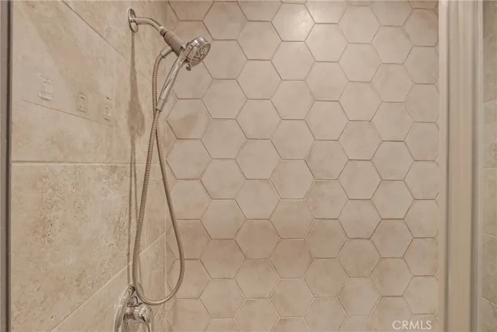 View of the primary bathroom featuring a full tub with a shower combination. A calming space to relax and refresh.