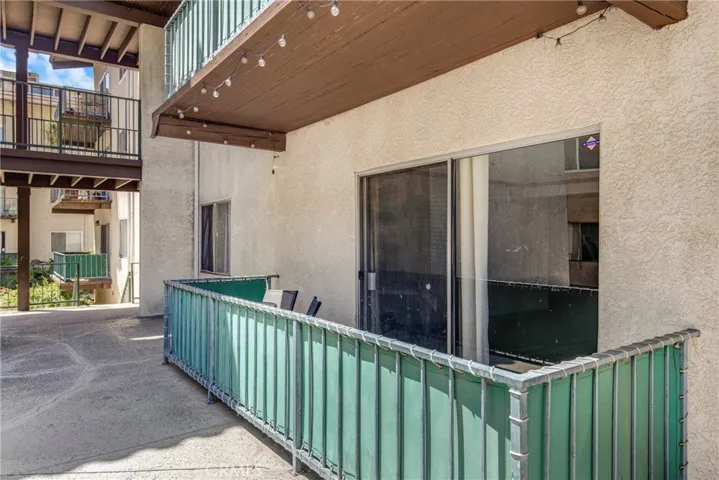 View of the private condo balcony, ideal for outdoor relaxation. The space offers a comfortable extension of the first-floor living area.