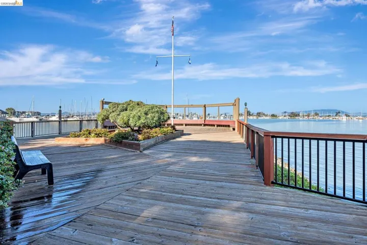 Dock featuring a deck with water view