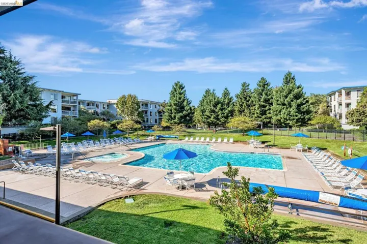 Community pool with a patio area