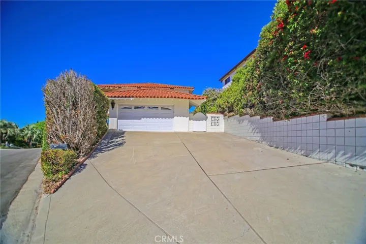Large Driveway to the Attached Two Car Garage.