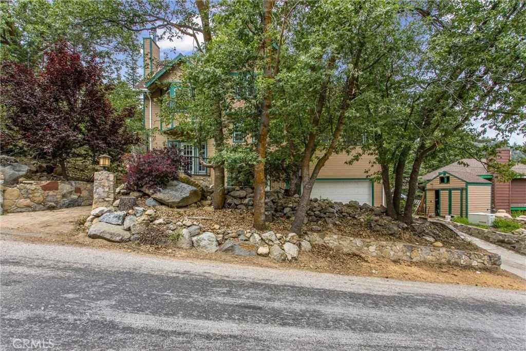 Home with attached garage, and separate shed.