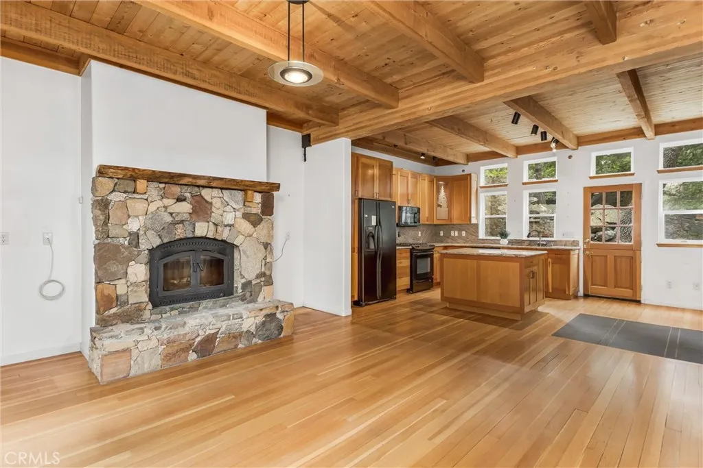 Dining Room with fireplace, looking into the kitchen