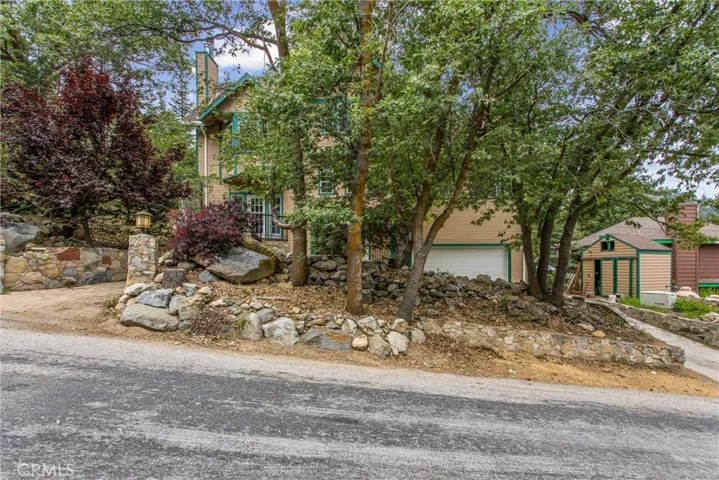 Home with attached garage, and separate shed.