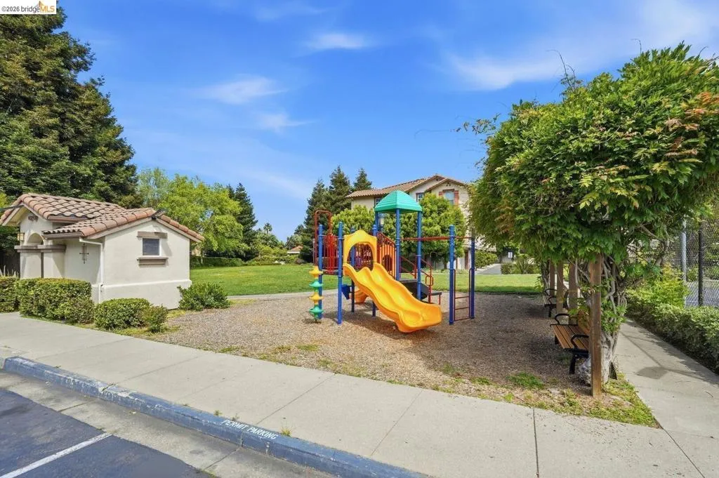 community jungle gym featuring a yard